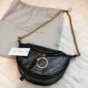 Philomena Wrinkled-effect Half moon Crossbody bag. Charles and Keith Brand